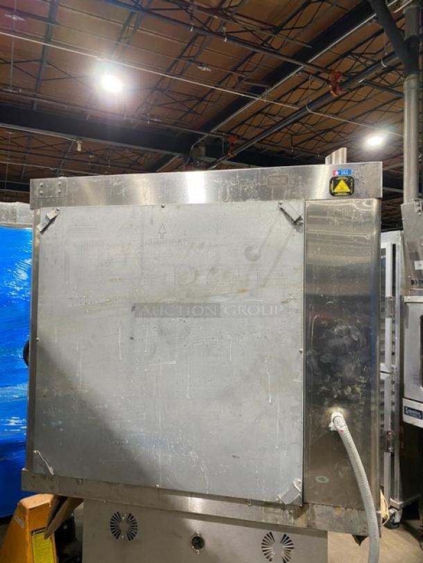 Alto-Shaam stainless steel electric countertop rotisserie oven with digital controls. Shows exterior wear; power cord visible.