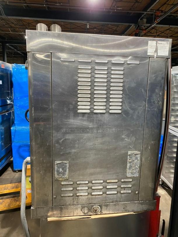 Alto-Shaam commercial stainless steel electric countertop rotisserie oven with digital controls, shown in good condition.