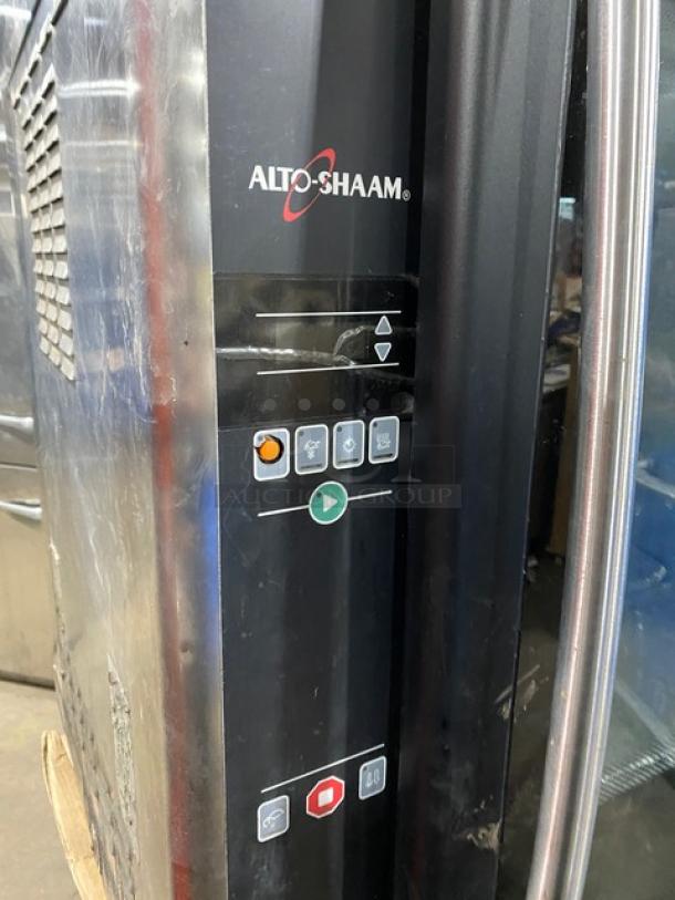 Alto-Shaam stainless steel countertop rotisserie oven with digital controls, good condition, brand logo visible.