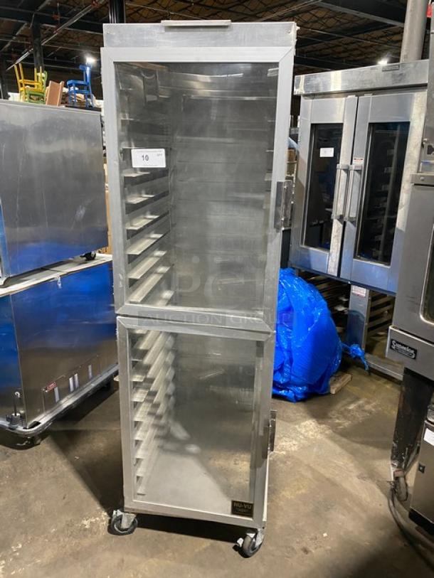 Commercial heavy-duty enclosed pan holding/transport rack on casters, stainless steel, multiple pan slots, gently used.