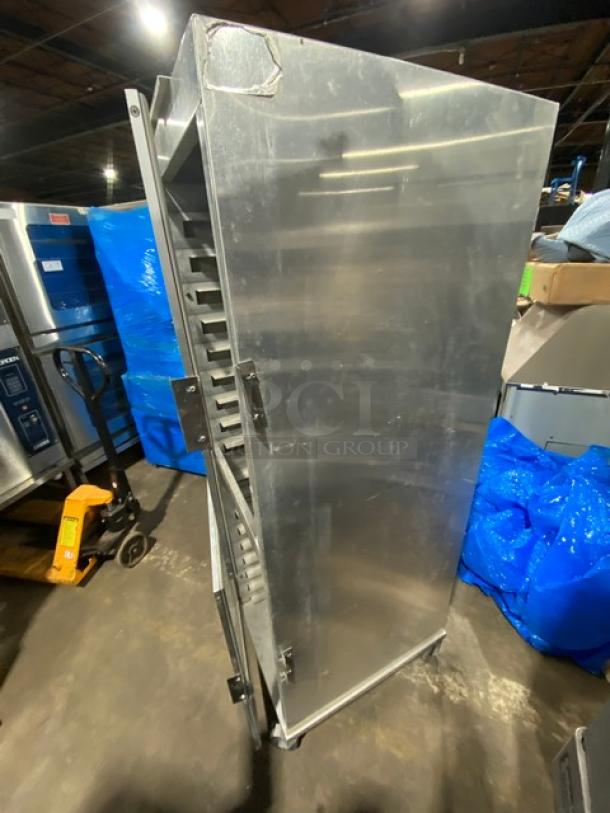 Commercial heavy-duty enclosed pan rack on casters, used for holding and transporting pans. Sturdy metal construction.