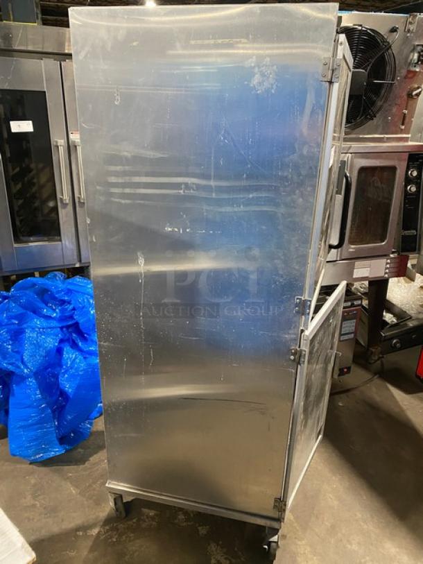 Commercial heavy-duty enclosed pan holding/transport rack on casters, metallic finish. Slight surface wear, ideal for kitchens.