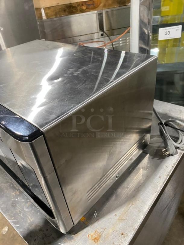 GE JES1145SH1SS stainless steel countertop microwave, 2018 model, electric powered, good condition, visible power cord.