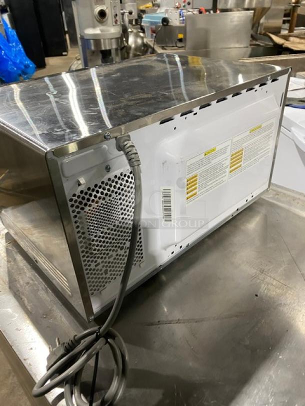2018 GE JES1145SH1SS commercial microwave, stainless steel, electric, excellent condition, visible rear label with specs.