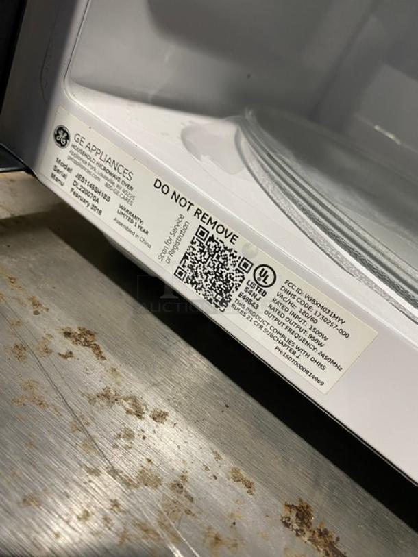 GE Appliances 2018 stainless steel countertop microwave oven, model JES1145SH1SS. Features labels with model, SN: DL220070A.