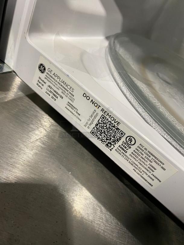 2018 GE stainless steel countertop microwave, model JES1145SH1SS, shown with interior label detailing model and SN LL287868A.