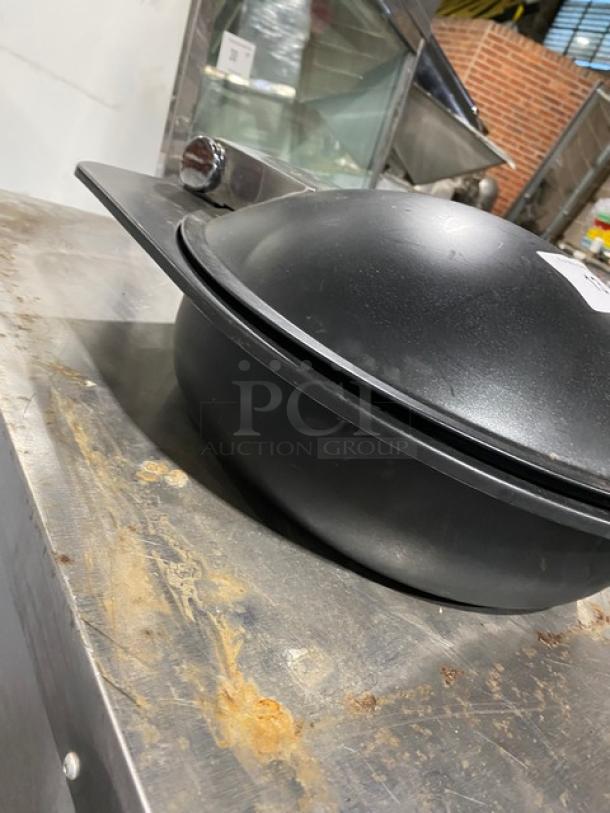 Spring USA induction chafing dish with chrome handle, black finish. Shows signs of use with some surface wear.