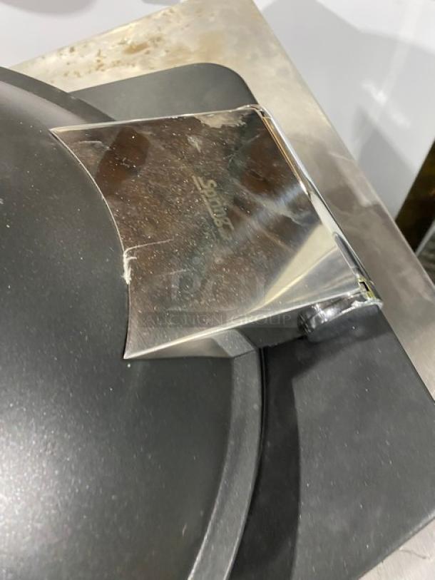 Spring USA commercial induction chafing dish with chrome handle, visible logo, slight surface wear, ideal for buffet use.