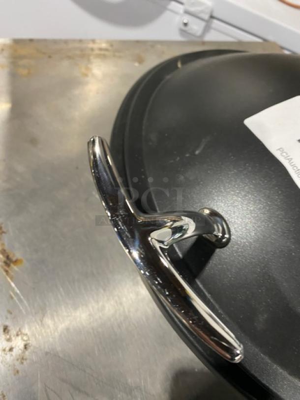 Spring USA induction chafing dish with chrome handle; black finish. High-quality, ideal for buffet settings.