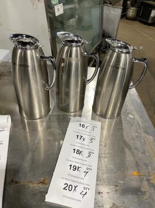 Service Ideas 1.5L stainless steel beverage pitchers, double wall insulation, labeled for coffee and hot water, excellent condition.