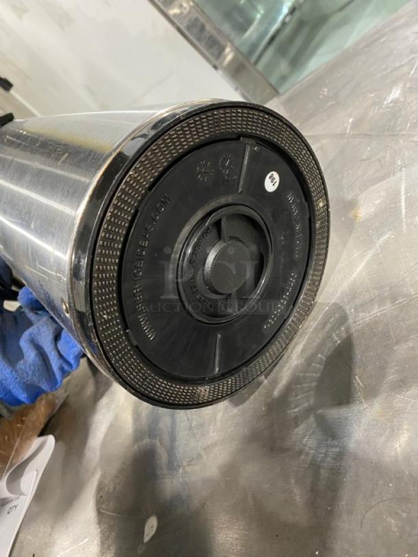 Commercial stainless steel insulated beverage dispenser, features a durable build with an easy-access lid; like-new condition.