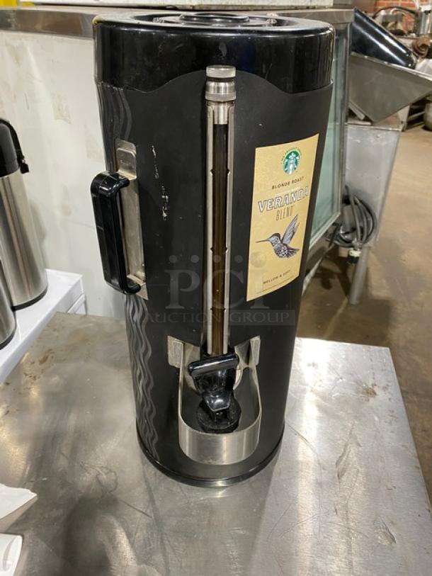 Fetco commercial black insulated beverage dispenser, Starbucks style, featuring a Veranda Blend label. Good condition.