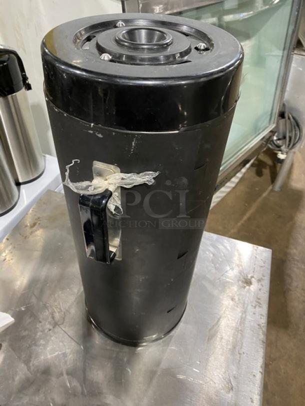 Fetco black insulated beverage dispenser, commercial quality, used, with handle, suitable for Starbucks-style serving.