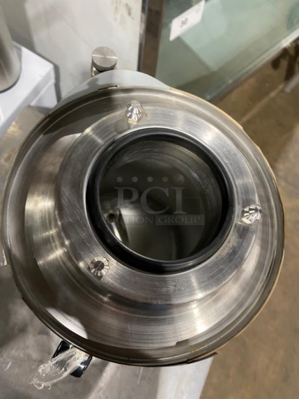 Fetco commercial black insulated beverage dispenser, stainless steel top, Starbucks style, used condition.