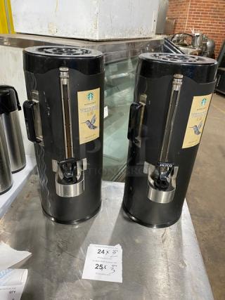 Fetco Starbucks-style black insulated beverage dispensers, two units, commercial-grade, with Vernonia labels, used condition.