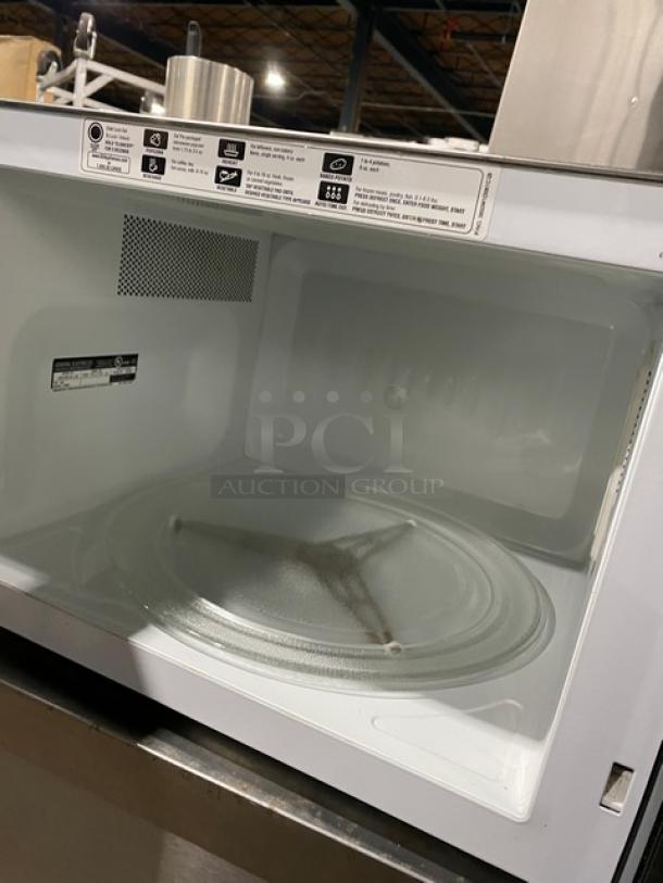 GE JES1651SJ02 stainless steel countertop microwave, late model 2009, electric powered, good condition. Serial: RS903160U.