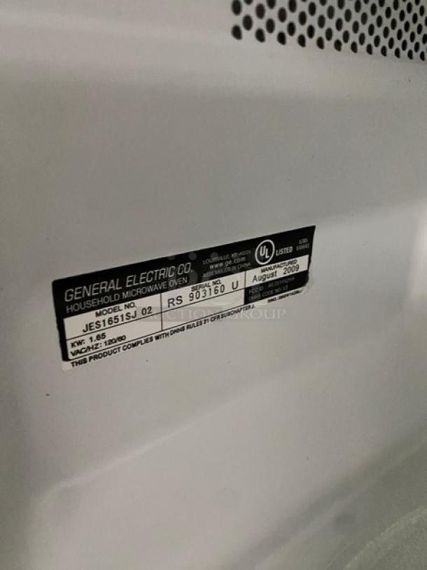 GE JES1651SJ02 stainless steel countertop microwave, 2009 model. Label shows model and serial number RS903160U.