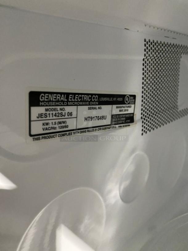 GE microwave model JES1142SJ06, 2010, stainless steel, 1.5 kW, serial HT917648U, commercial electric countertop model.