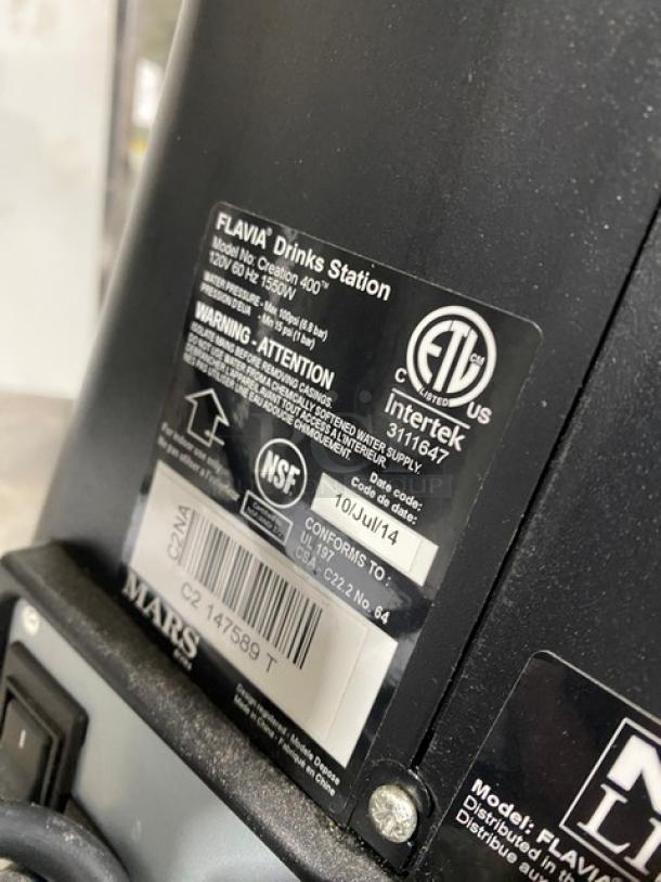 Mars Drinks Flavia Series coffee machine, Creation400TM model, black, ETL and NSF certified, 120V, 1550W, serial number visible.