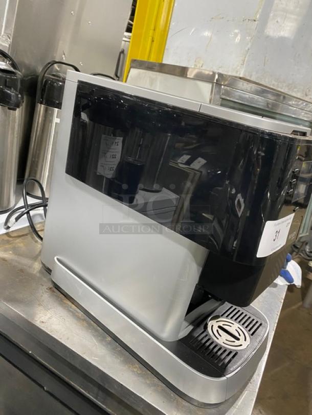 Mars Drinks 2016 Flavia Creation Series coffee machine, compact, electric, single-serve, black and silver, commercial-grade.