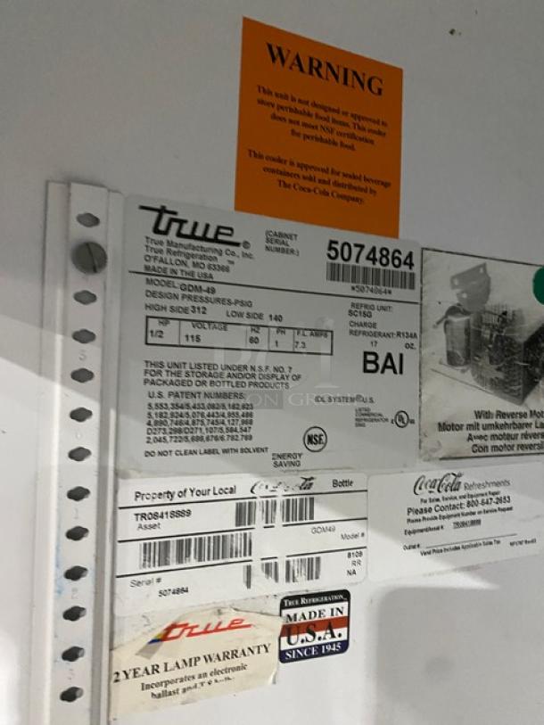 True Commercial Double Glass Door Refrigerator, Model GDM-49, SN 5074864, 115V 1 Phase, NSF-certified labels visible.