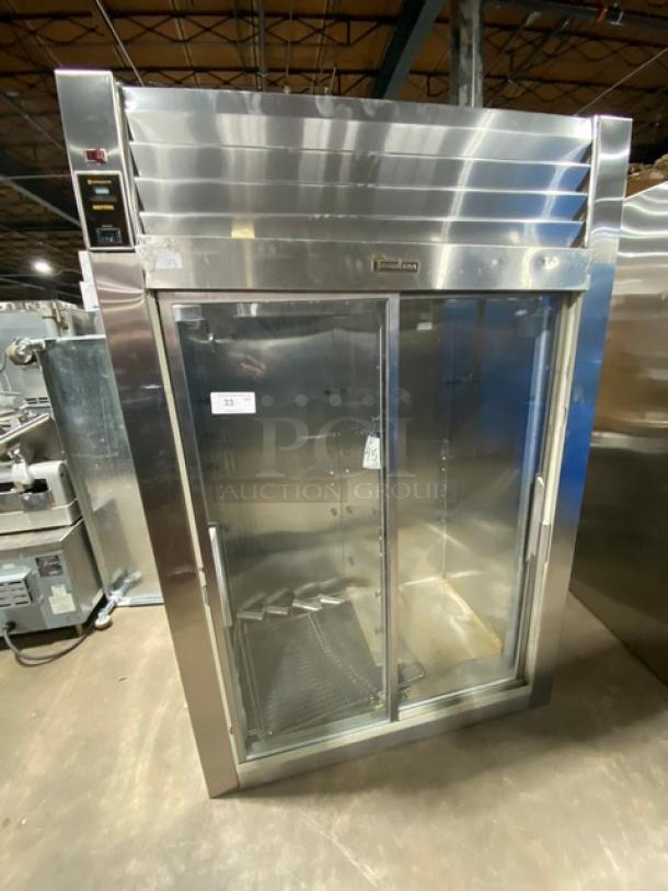 Traulsen stainless steel refrigerator, model RHT232NUTSL-012, with 2 sliding glass doors and wired rack. Electric, 115V, 1 Phase.