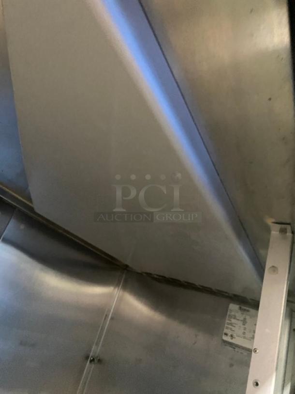 Traulsen stainless steel refrigerator interior, electric, Model RHT232NUTSL012, with 2 sliding glass doors and wired rack.