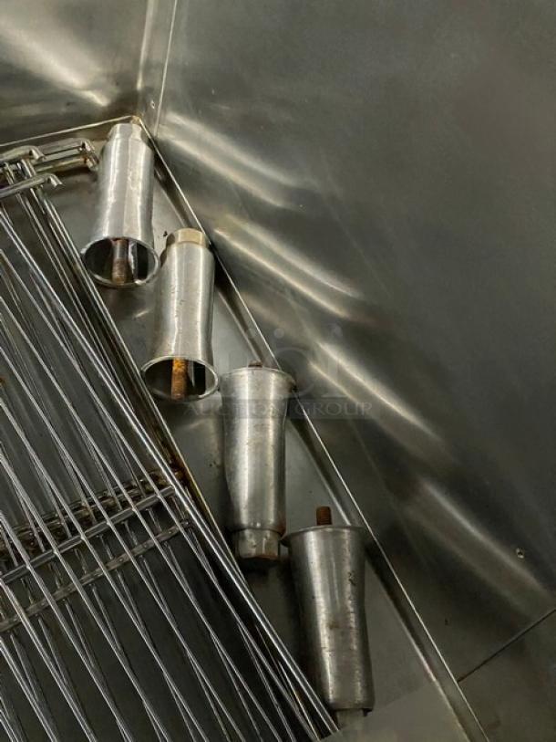 Traulsen stainless steel refrigerator interior with wired rack, model RHT232NUTSL012, showing sturdy construction.