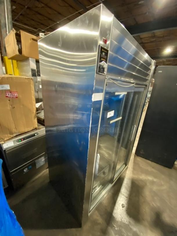 Traulsen stainless steel commercial refrigerator, model RHT232NUTSL012. Features 2 sliding glass doors, wired rack, and 115V power.
