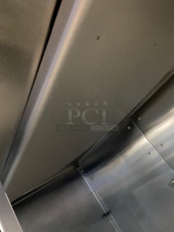 Traulsen stainless steel refrigerator interior view, Model RHT232NUTSL-012, features 2 sliding glass doors.