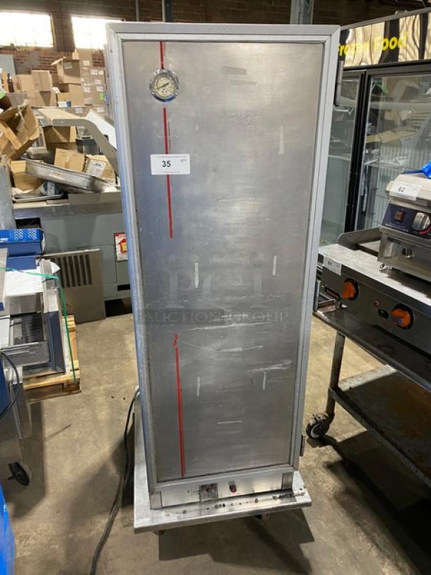 Commercial stainless steel electric insulated heating/proofing cabinet with built-in pan racks, on casters, with temperature gauge.