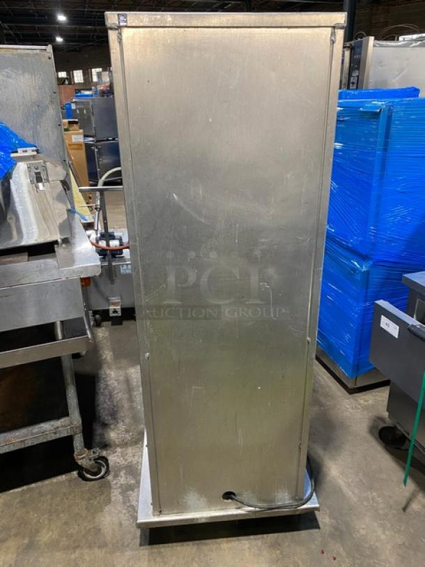 Commercial stainless steel electric warming cabinet, insulated with built-in pan racks, on casters, in used condition.
