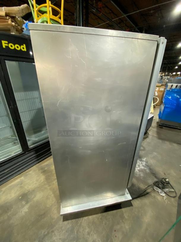 Commercial stainless steel electric heating/proofing cabinet, insulated, with built-in pan racks, on casters. Scratched surface.