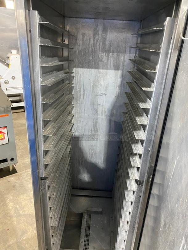 Commercial stainless steel electric heating/proofing cabinet, insulated, with built-in pan holding racks, on casters.