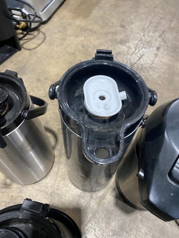 Stainless steel insulated beverage dispenser, commercial grade, top open, good condition, durable, ideal for thermal retention.