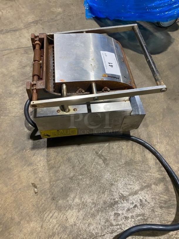 Lang Pane Bella Series stainless steel panini griddle, model PB-12, with grooved grates and legs. Electric powered.