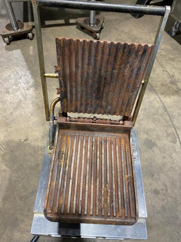 Lang Pane Bella Series PB-12 commercial panini griddle with grooved grates, stainless steel, on legs. Used condition with visible rust.