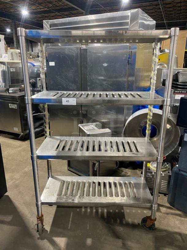 Commercial heavy-duty 4-tier mobile drying rack on casters, stainless steel, good condition. Suitable for industrial use.