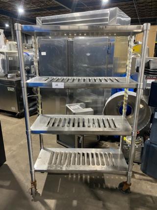 Commercial heavy-duty 4-tier mobile drying rack on casters, stainless steel, good condition. Suitable for industrial use.