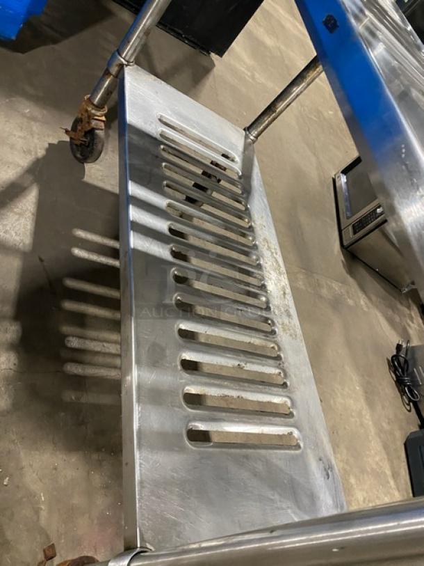 Commercial heavy-duty 4-tier mobile drying/utility rack on casters, metal construction, sturdy design, some surface wear.