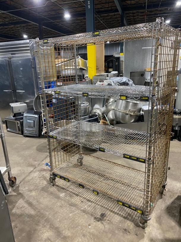 Commercial 4-tier mobile enclosed wired-rack utility/storage cart on casters, metal construction, excellent condition.
