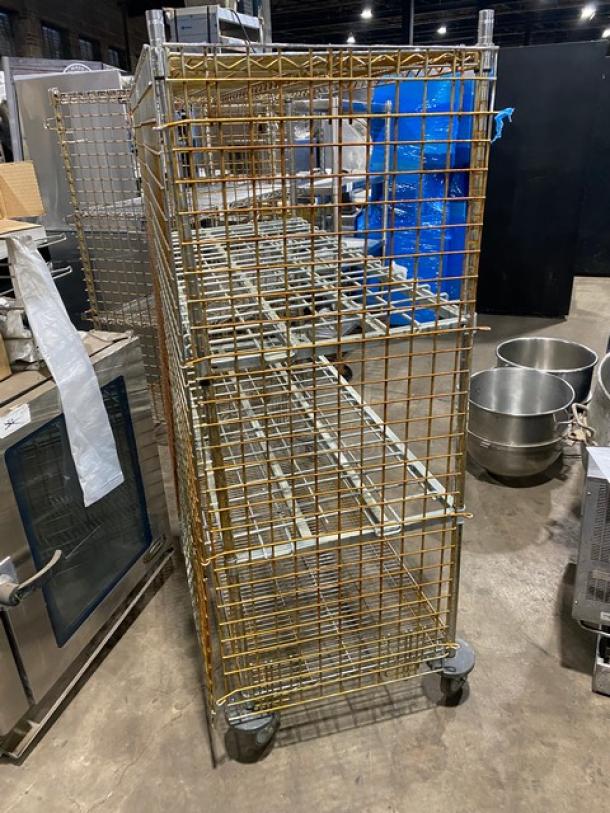 Commercial 4-tier mobile enclosed wired-rack utility/storage cart on casters, used condition, metal, sturdy design.
