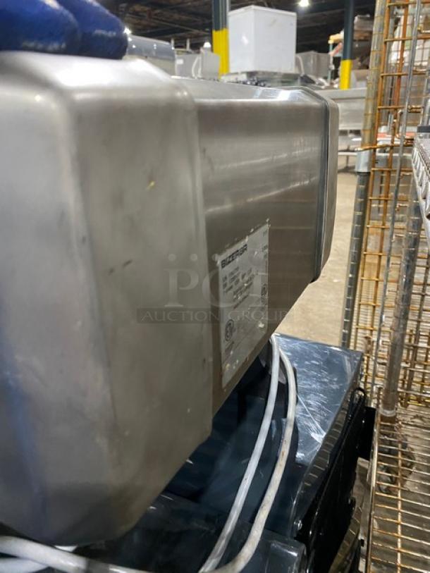 Bizerba S111 electric meat tenderizer, commercial-grade, stainless steel, countertop model, tag with model info visible.