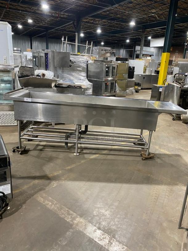 Commercial stainless steel single-well extra-large ice bin with right side drain board, on legs. Ideal for cocktail stations.