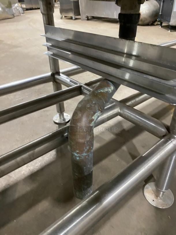 Commercial stainless steel single-well extra-large ice bin with right side drain board, on legs in used condition.