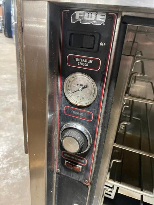 FWE UHS-4 stainless steel undercounter heated holding cabinet with control panel, temperature gauge, and casters.