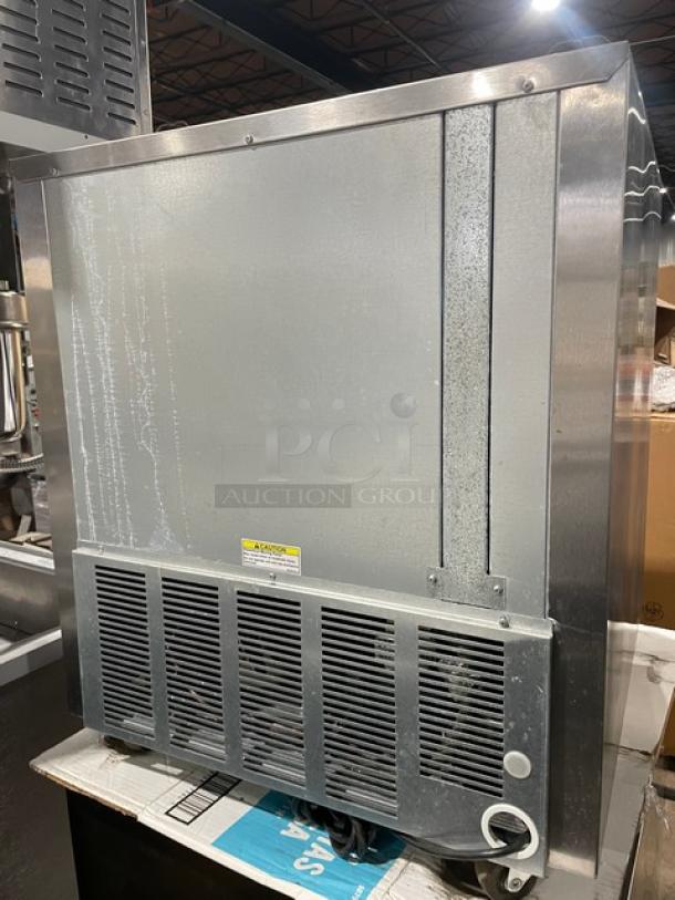 Beverage-Air UCR27A stainless steel undercounter refrigerator, single door, on casters, with poly-coated wire rack.