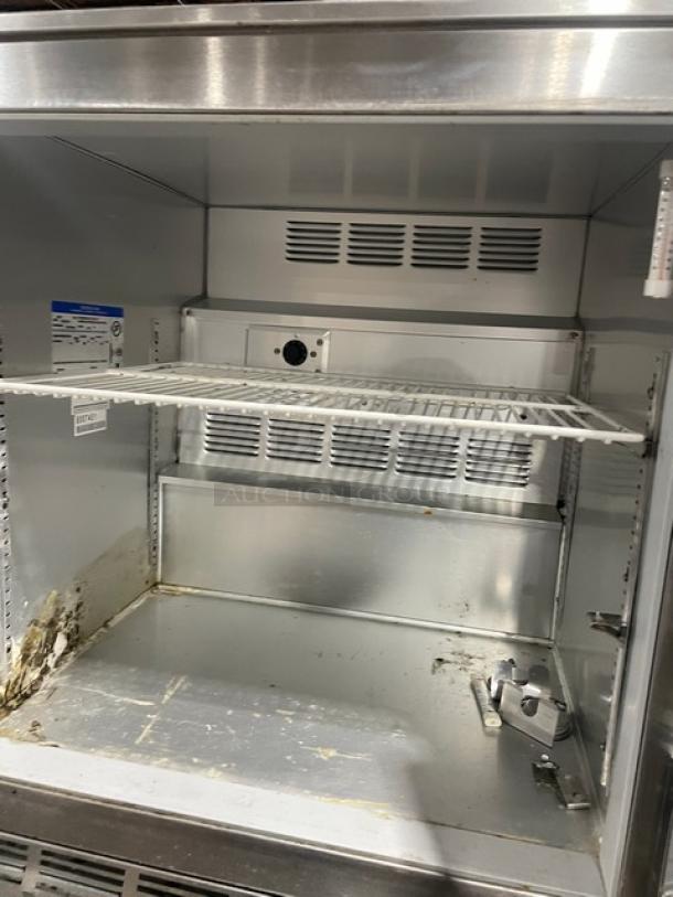 Beverage-Air UCR27A single door undercounter refrigerator, stainless steel, includes poly coated wire rack, on casters, used condition.