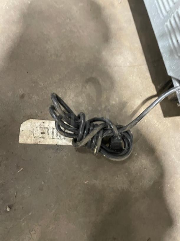 Beverage-Air UCR27A stainless steel undercounter refrigerator, single door, with poly coated wire rack, 115V, on casters.