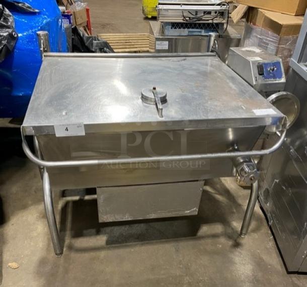 Cleveland Range stainless steel gas-powered tilting braising pan. Features lever for easy tilting, sturdy legs, and secure lid.